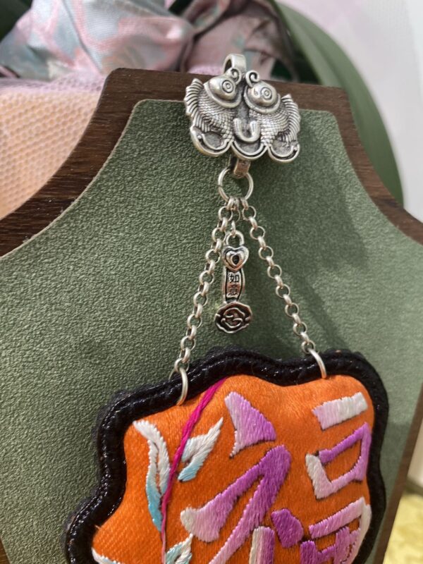 Handmade Miao embroidery silver brooch - orange background with Fu character pattern and tassels - Image 2