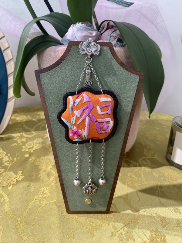 Handmade Miao embroidery silver brooch - orange background with Fu character pattern and tassels